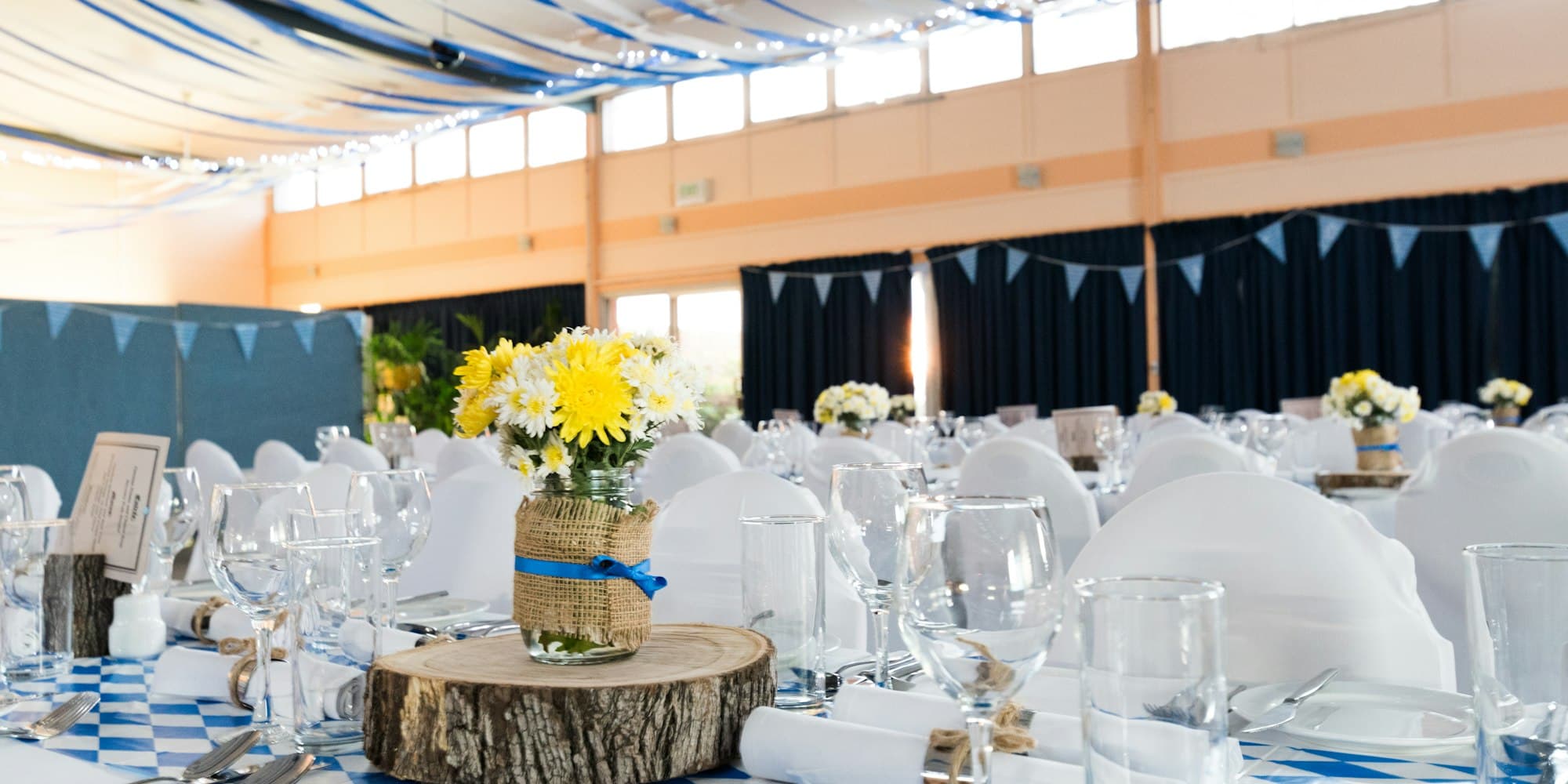Wedding reception hall decorated for a celebration — the right placement for an audio guestbook phone doubles recording counts