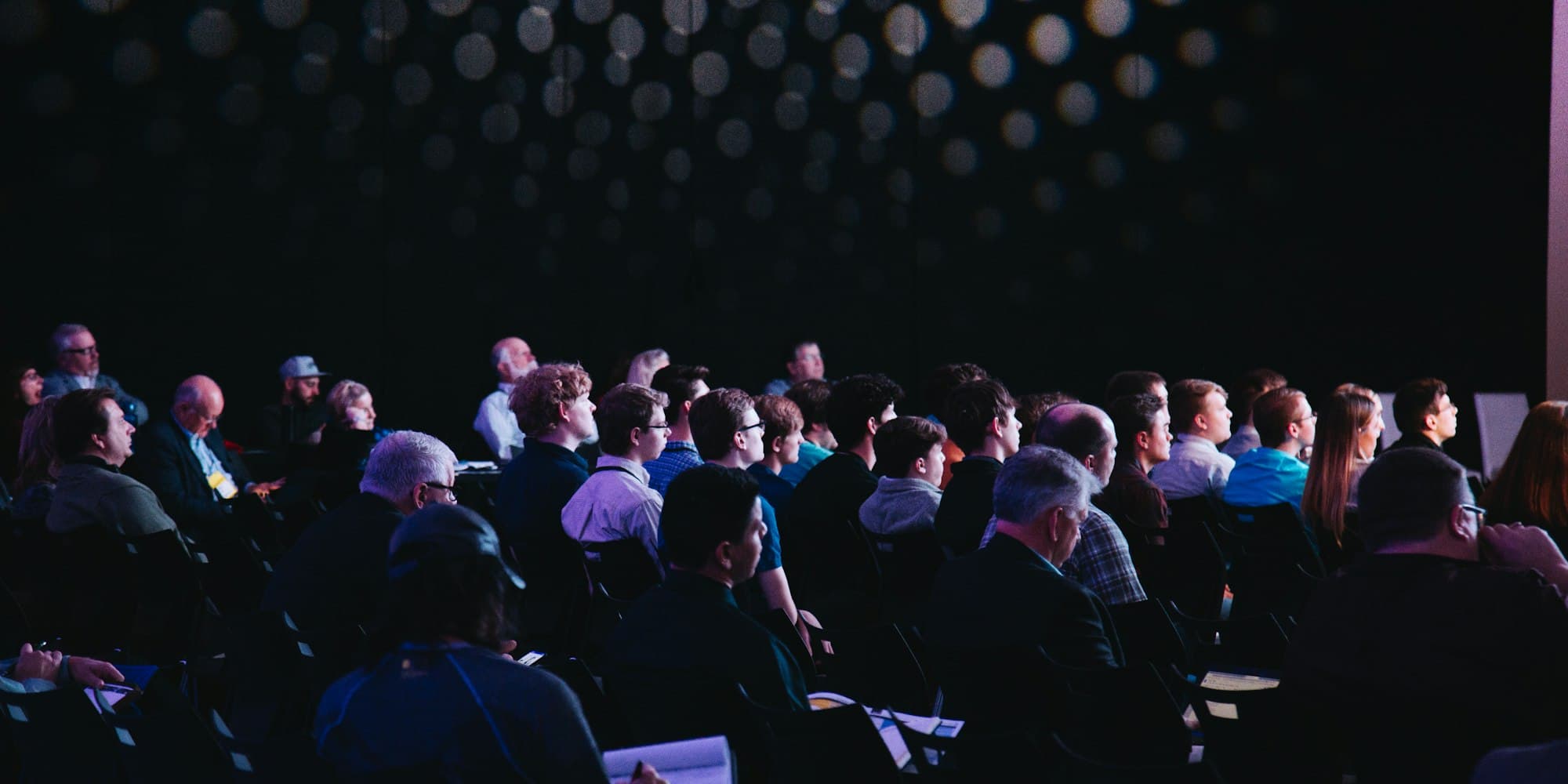 Corporate event guests leaving voice messages at an audio guestbook station